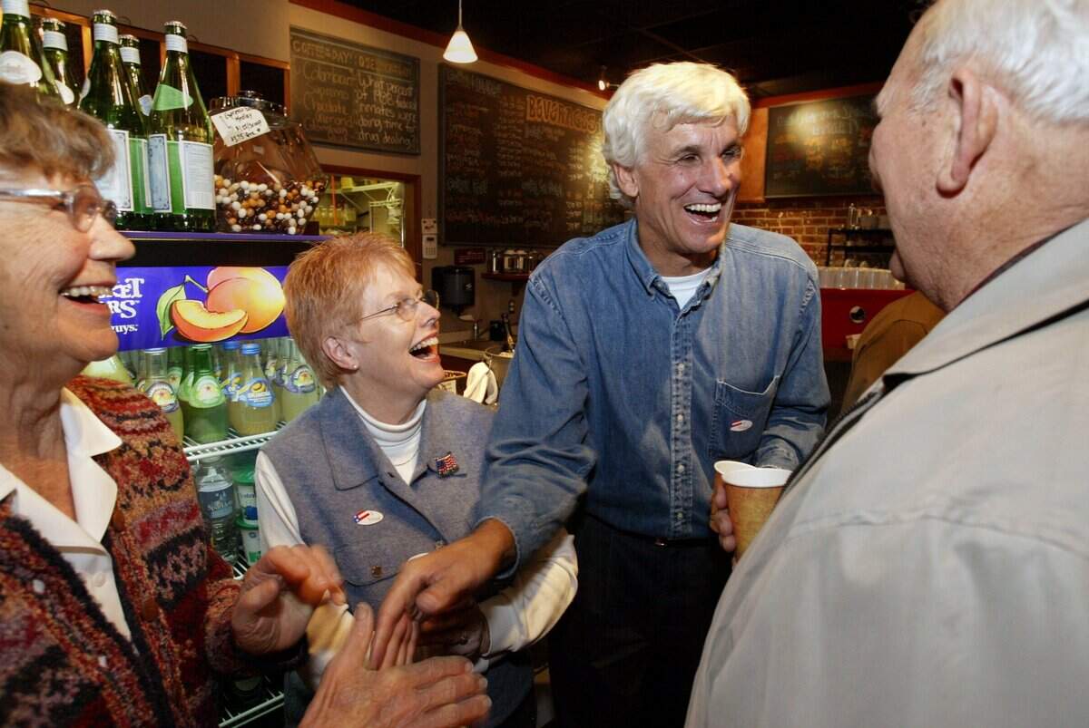 Then Visalia City Council candidate Greg Collins celebrates with supporters during an election party at Tazzaria Coffee and Tea in downtown Visalia on Nov. 8, 2005. Collins, who served on the council for about 30 years, died Thursday in Visalia. He was 76.